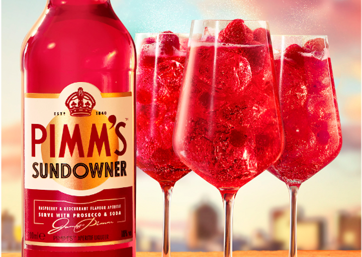 Bottle of Pimm's Sundowner with cocktails in glasses