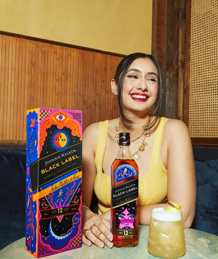 Kushiaania with the Johnnie Walker Black Label Bold Steps bottle 