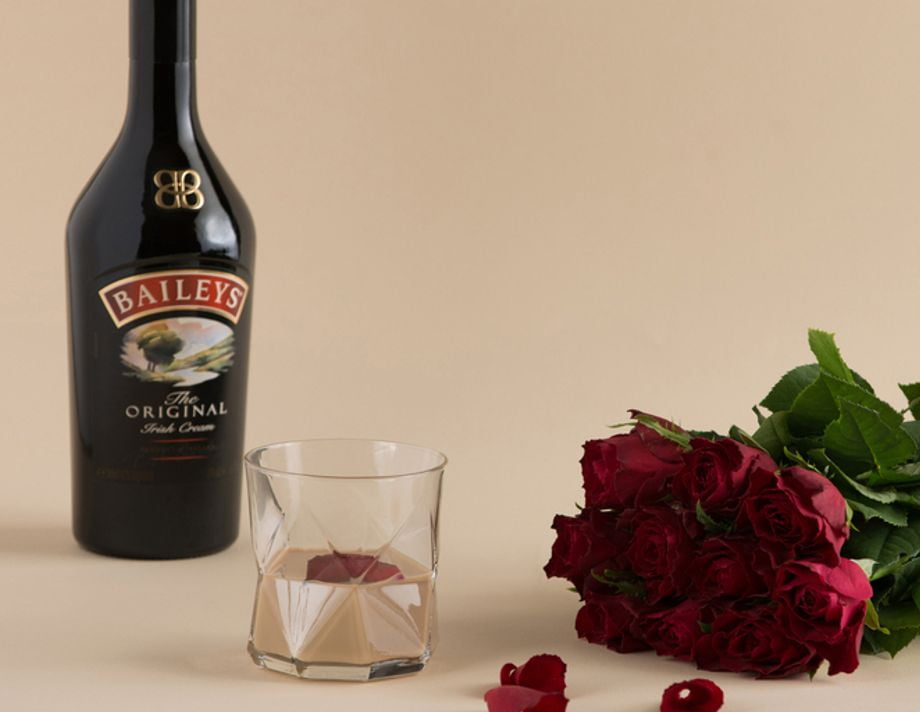 Baileys Original lifestyle image with glass and roses