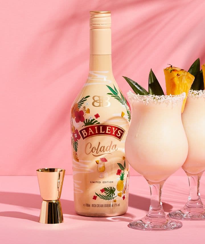 baileys colada and cocktails by a pool